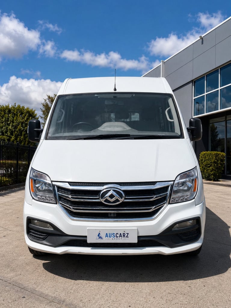 White commercial van parked in front of a building, viewed from the front