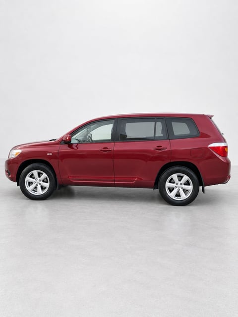 Red Toyota Kluger SUV shown in profile view against a white background