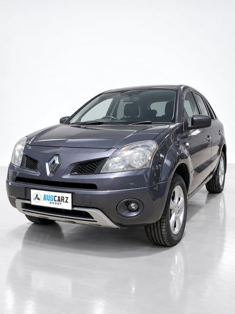 Dark gray Renault Koleos SUV displayed in front profile against white background with AusCarz watermark