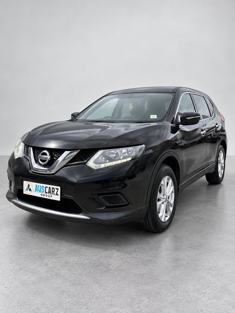 Black 2014 Nissan X-Trail T32 seven-seat SUV front three-quarter view - cover photograph