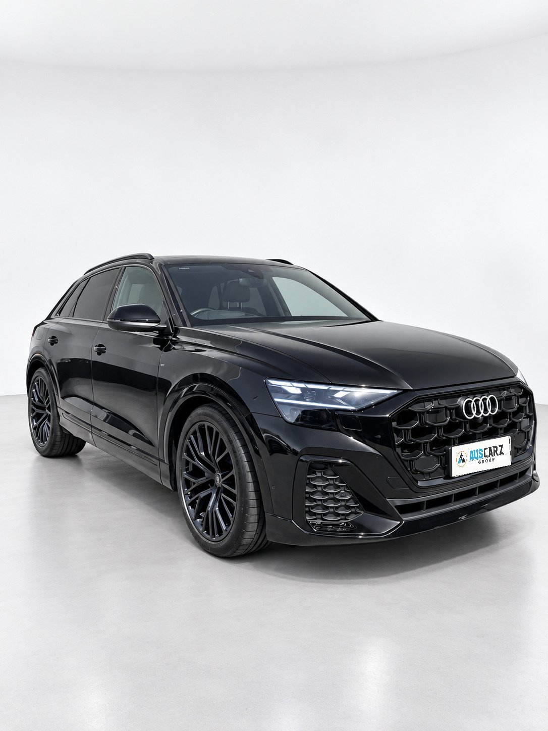 2024 Audi Q8 50 TDI quattro front three-quarter view with the octagonal grille and quattro styling