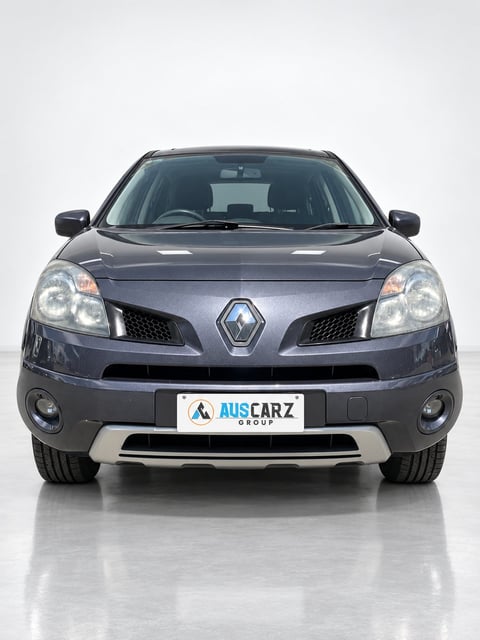 Front view of a gray Renault Koleos SUV with AUSCARZ Group license plate on white background