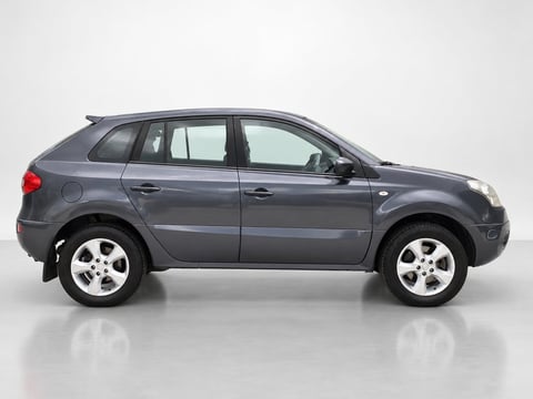 Gray compact SUV displayed from the drivers side view against a white background