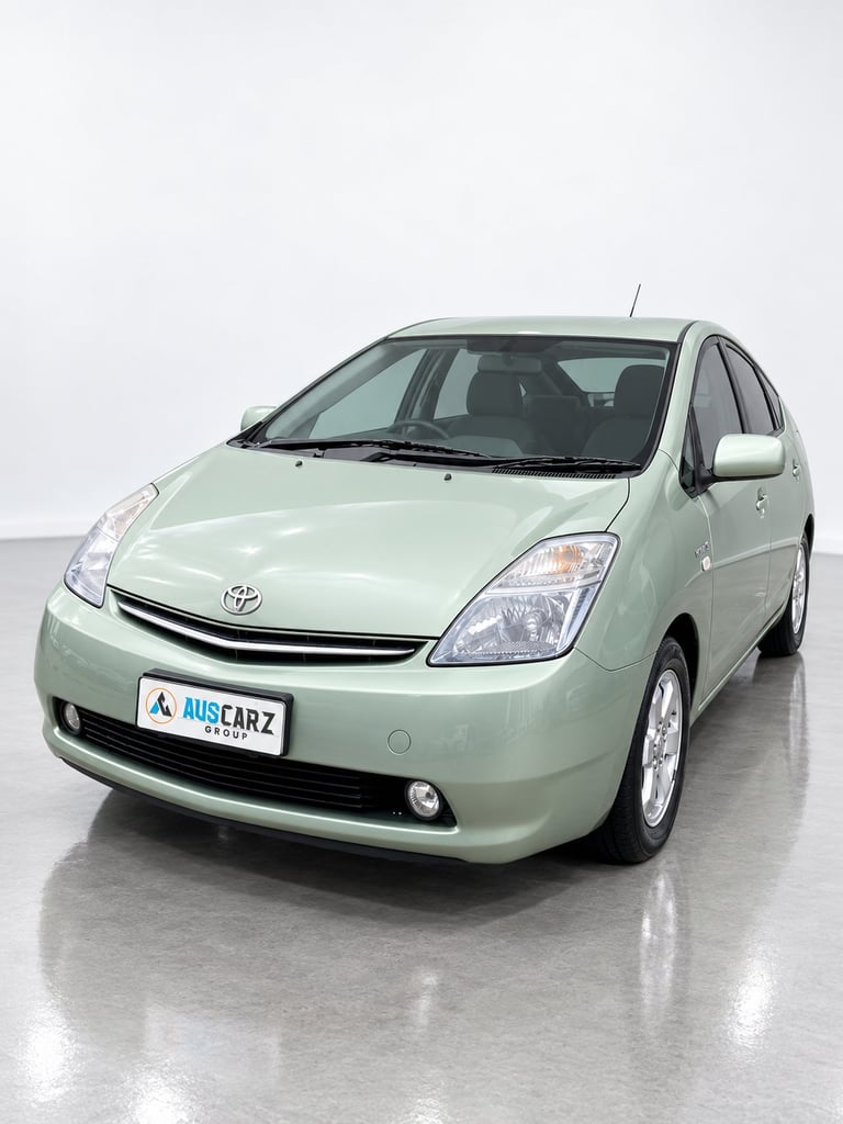 Light green Toyota Prius hybrid car photographed from front-left angle in studio setting