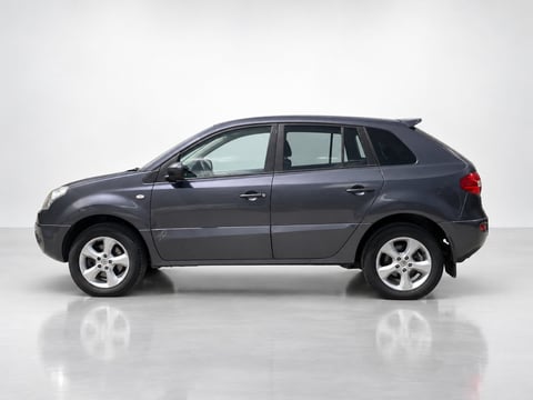 Gray compact SUV photographed from the side against a white background, showing all doors and wheels clearly