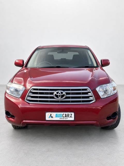 Front view of a red Toyota Kluger SUV with AUSCARZ license plate against a white background